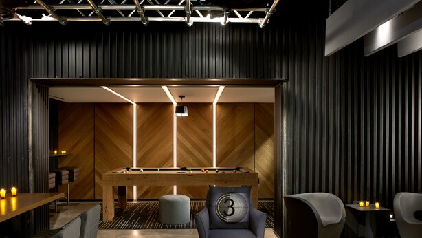 A modern lounge area with a pool table, comfortable seating, and ambient lighting. - Kimpton Hotel Palomar Los Angeles Beverly Hills by IHG (Los Angeles)