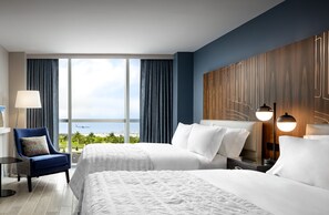 A hotel room with two beds, a view of the ocean, and a modern decor. - Le Méridien Dania Beach at Fort Lauderdale Airport (Dania Beach)
