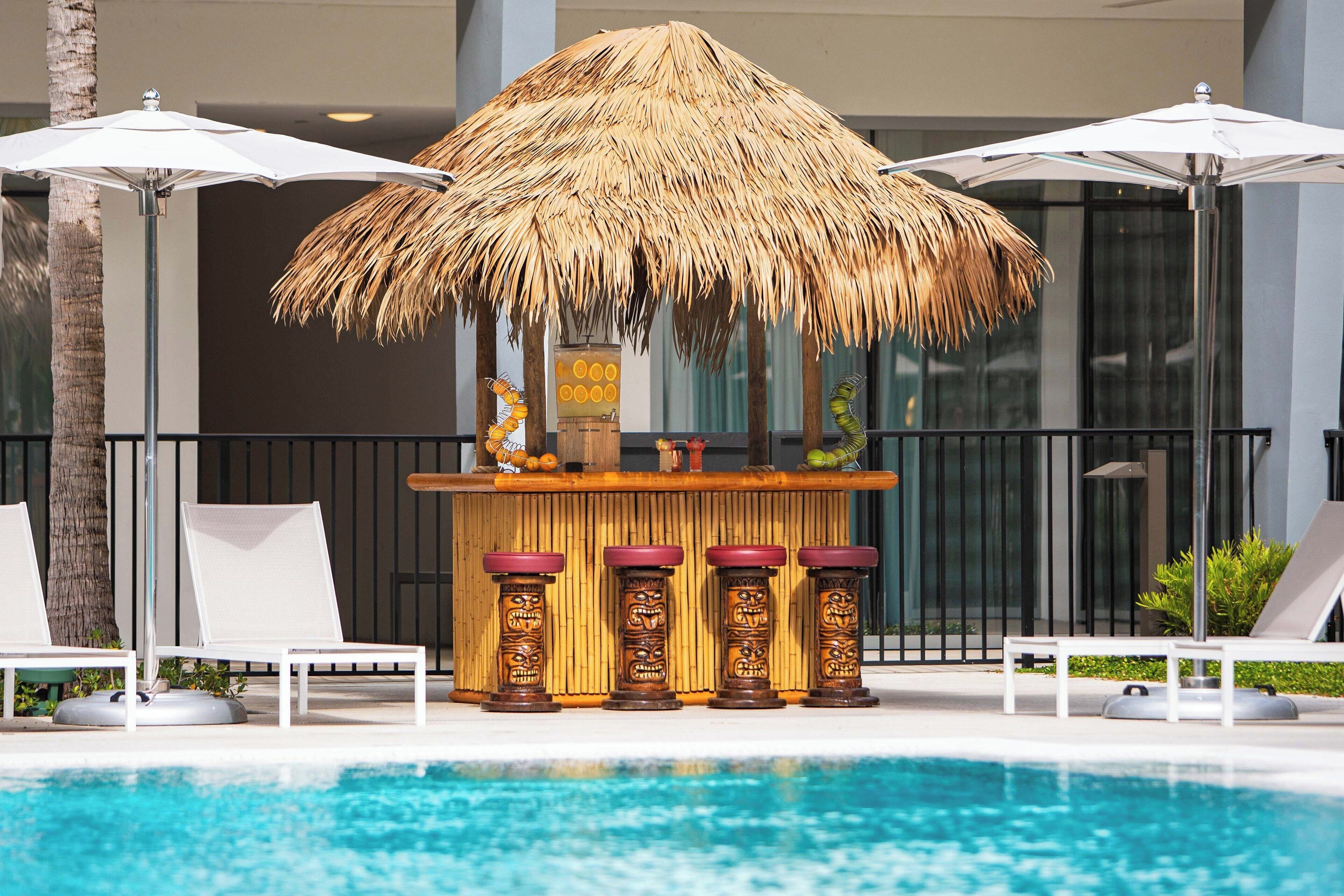 outdoor pool, open 6:30 am to 8:00 pm, pool umbrellas, pool loungers