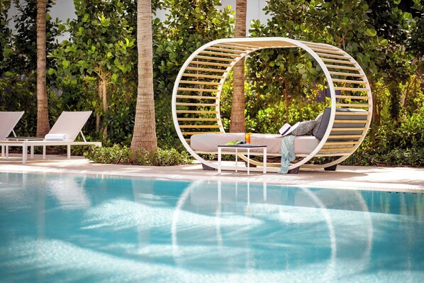 Outdoor pool, open 6:30 AM to 8:00 PM, pool umbrellas, pool loungers