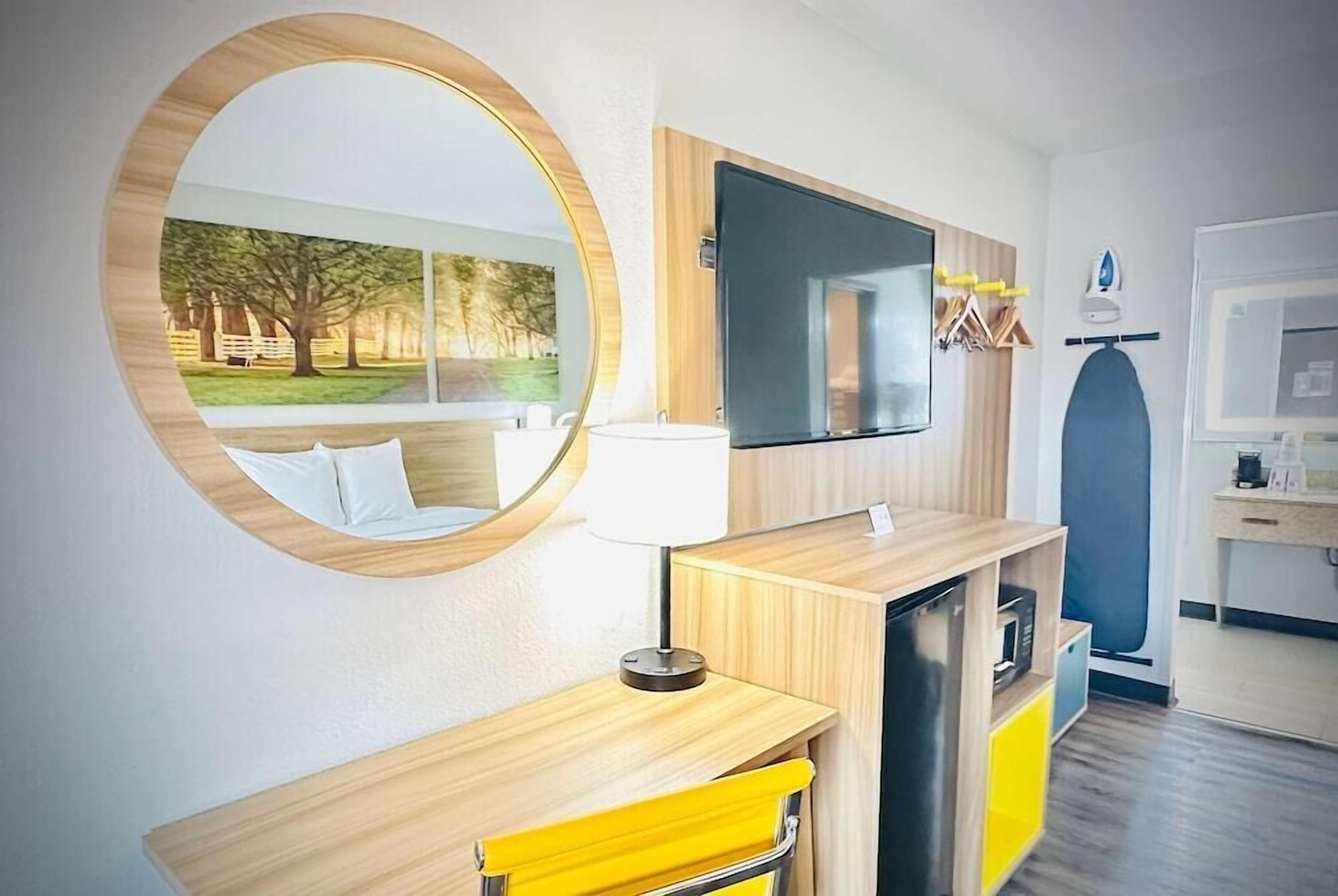 Desk, laptop workspace, blackout drapes, iron/ironing board