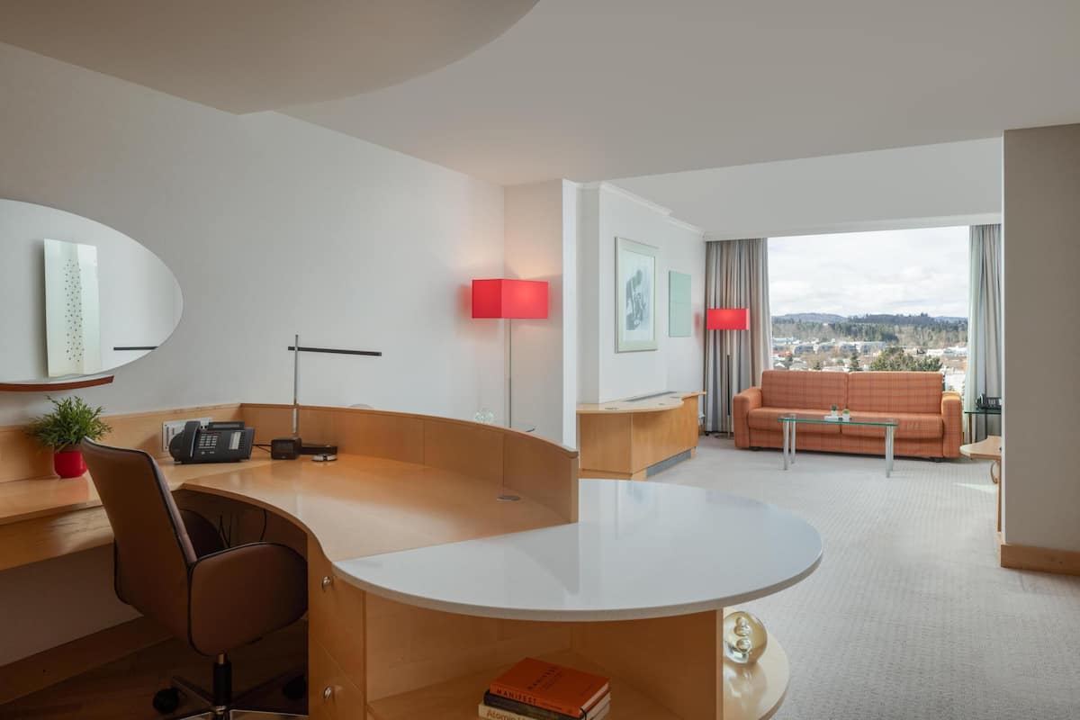 Suite, 1 King Bed | Living area | 50-inch LED TV with satellite channels, TV, heated floors