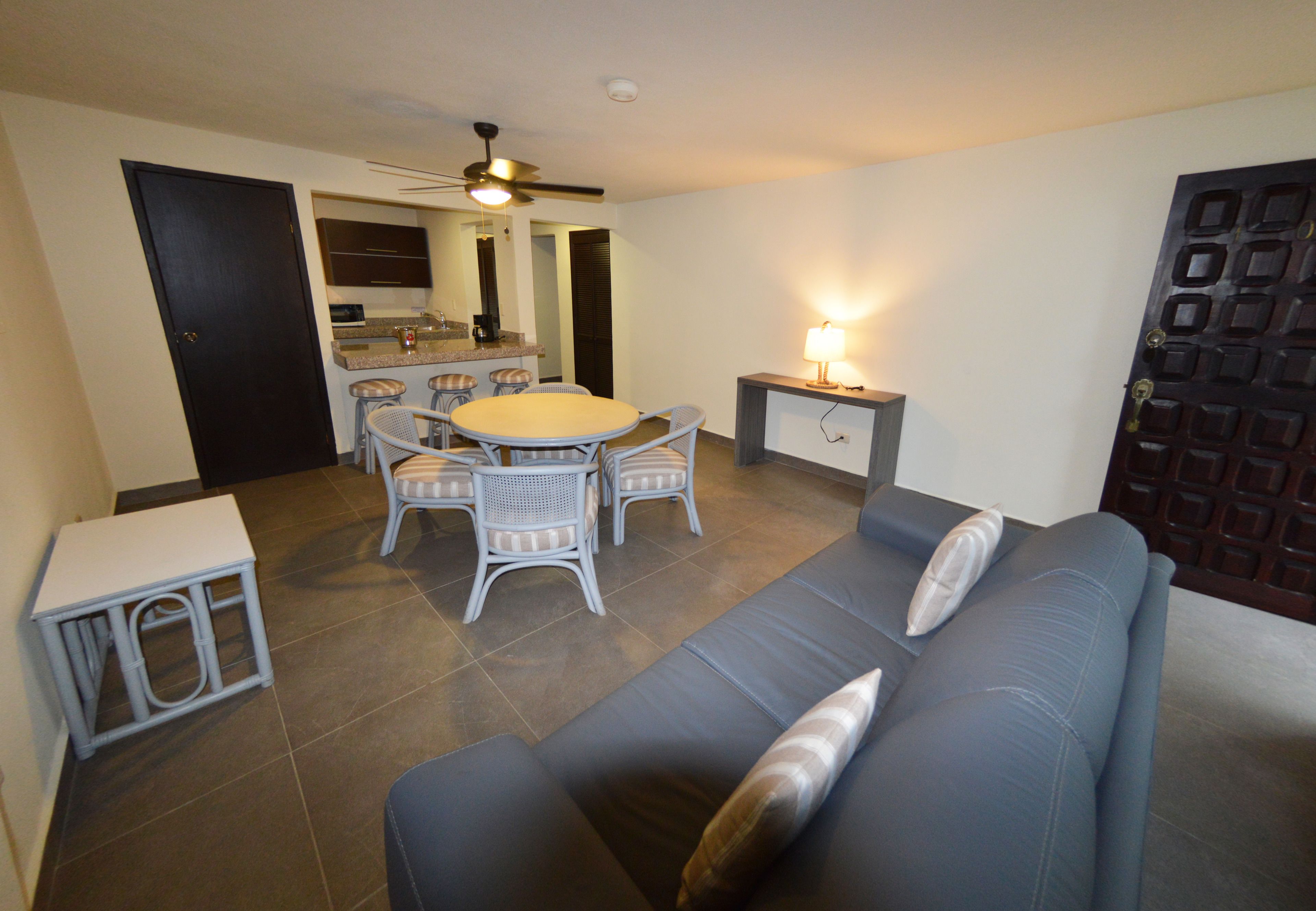 luxury junior suite lagoon view  | living room | 40-inch smart tv with satellite channels, books, streaming services