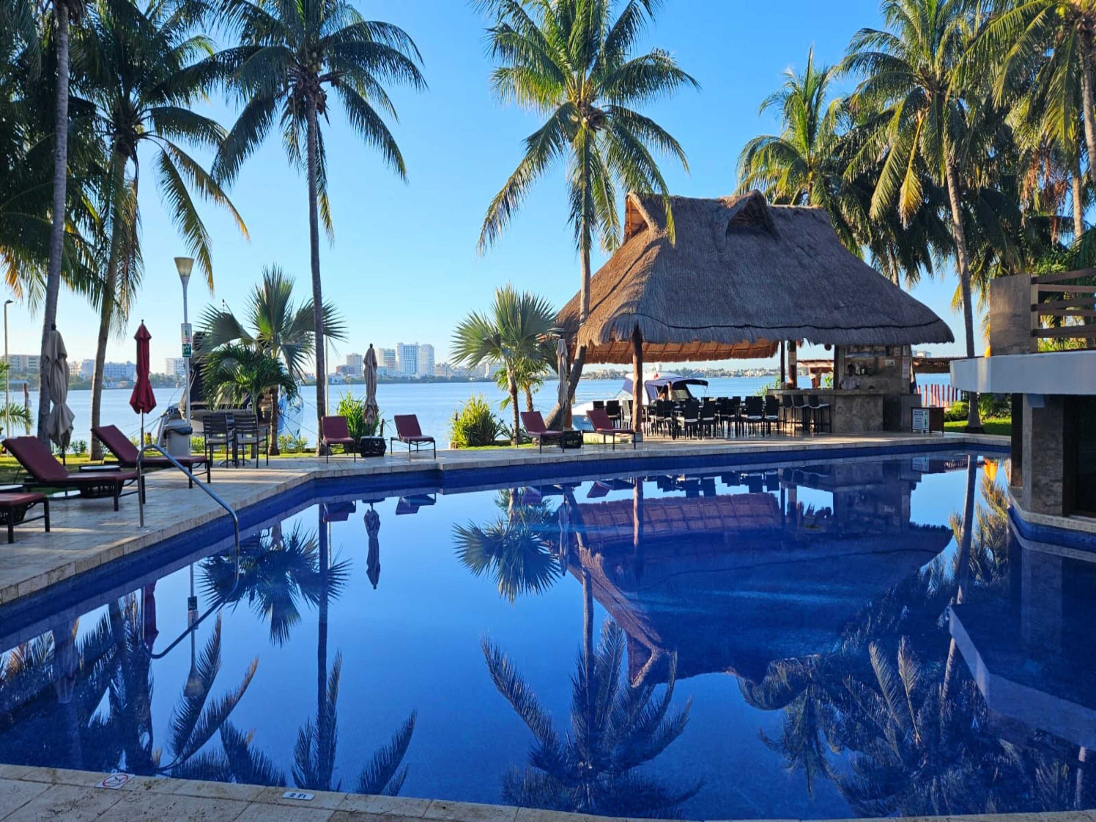 outdoor pool, open 7:30 am to 10:30 pm, pool umbrellas, pool loungers