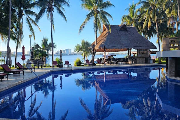 Outdoor pool, open 7:30 AM to 10:30 PM, pool umbrellas, sun loungers