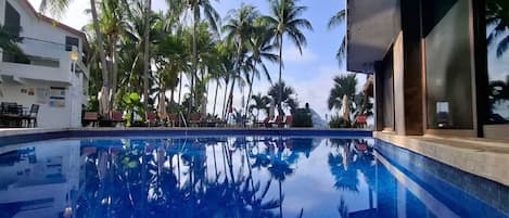 Outdoor pool, open 7:30 AM to 10:30 PM, pool umbrellas, pool loungers