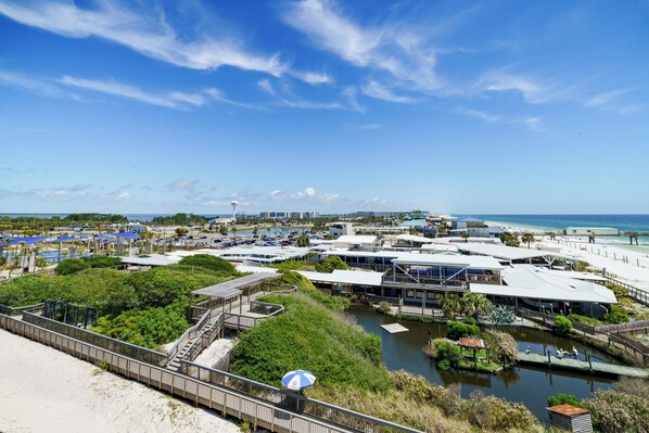 A coastal resort with multiple buildings, a boardwalk, and a beach area. - Four Points by Sheraton Destin-Fort Walton Beach (Fort Walton Beach)