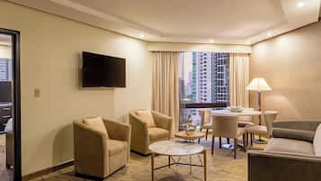 Executive Suite, 1 King Bed, City View | Living room | 48-inch LED TV with cable channels, TV, pay movies