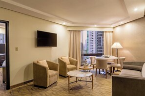 Executive Suite, 1 King Bed, City View | Living room | 48-inch LED TV with cable channels, TV, pay movies - Sheraton Grand Panama (Panama City)