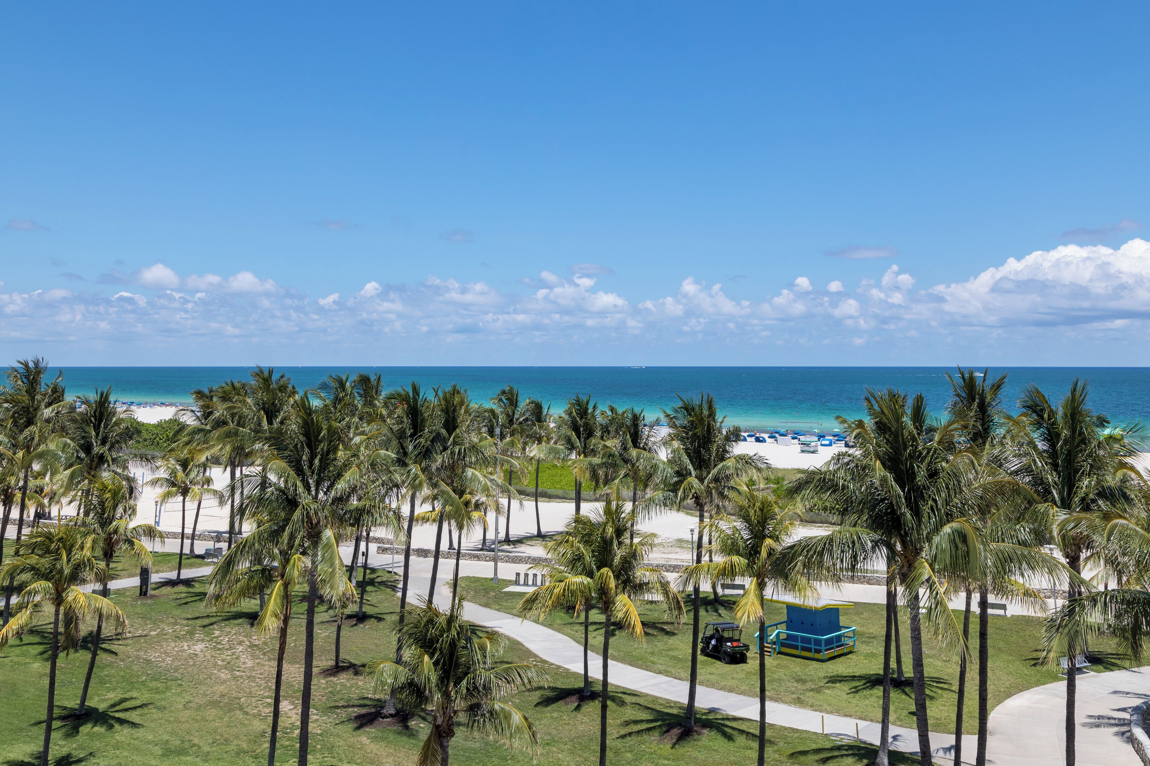 Beach nearby, white sand, sun loungers, beach towels