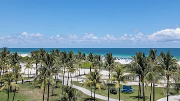 Beach nearby, white sand, sun loungers, beach towels