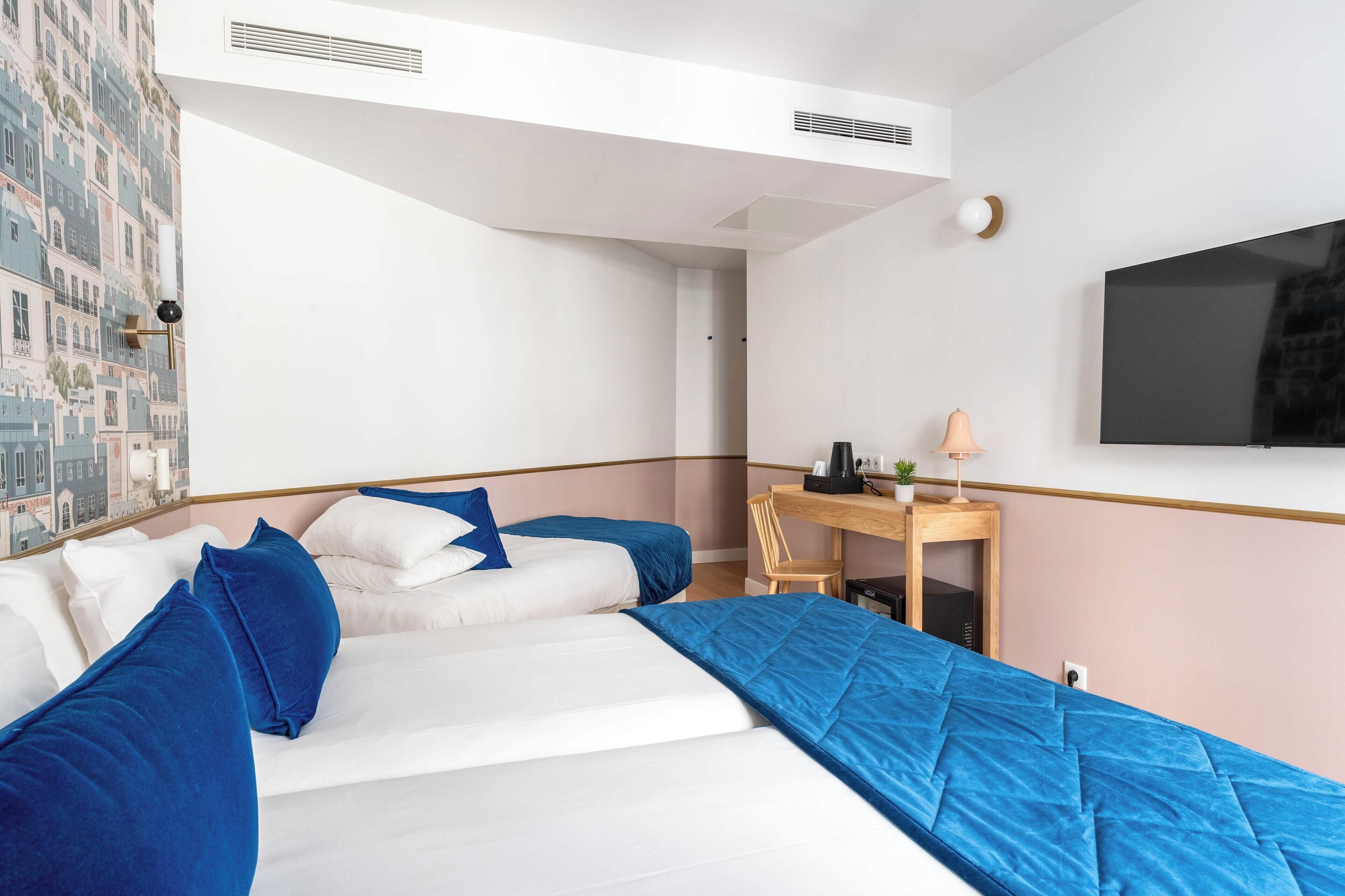 triple room - complimentary soft minibar, courtesy tray, chromecast - snacks and digital press | minibar, in-room safe, desk, blackout curtains