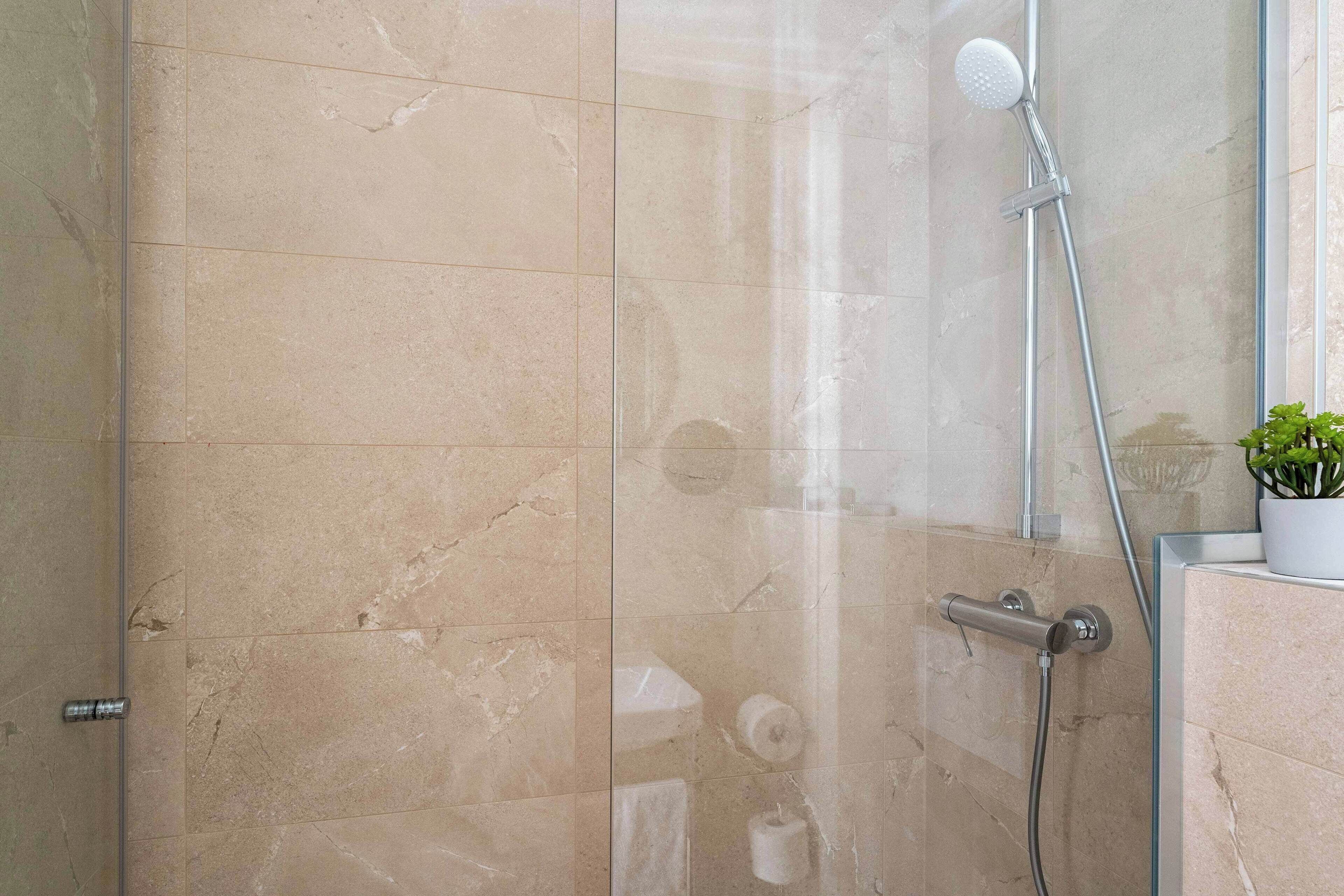 triple room - complimentary soft minibar, courtesy tray, chromecast - snacks and digital press | bathroom | shower, eco-friendly toiletries, hair dryer, towels