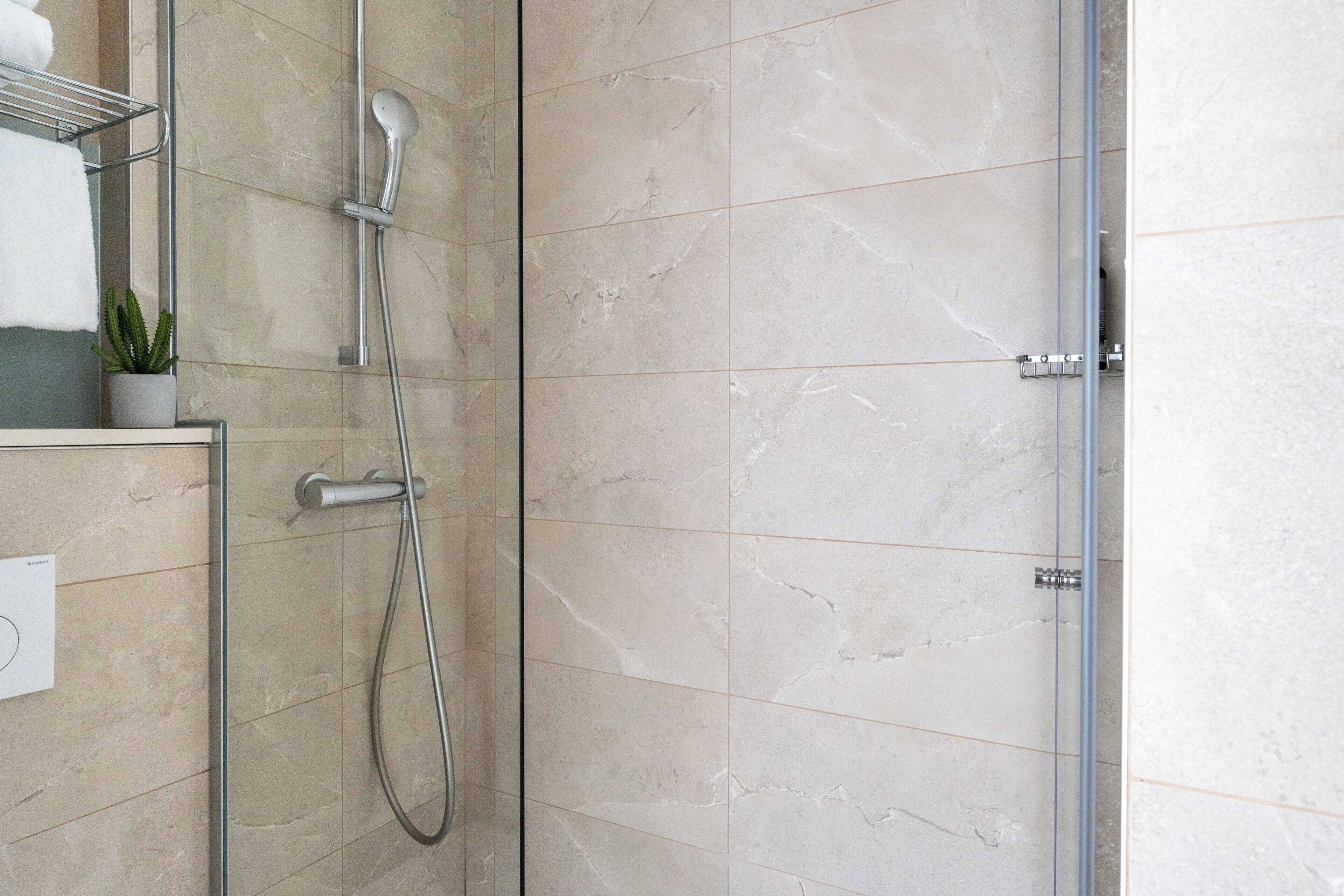 family, 2 rooms - complimentary soft minibar, courtesy tray, chromecast - snacks and digital press | bathroom | shower, eco-friendly toiletries, hair dryer, towels