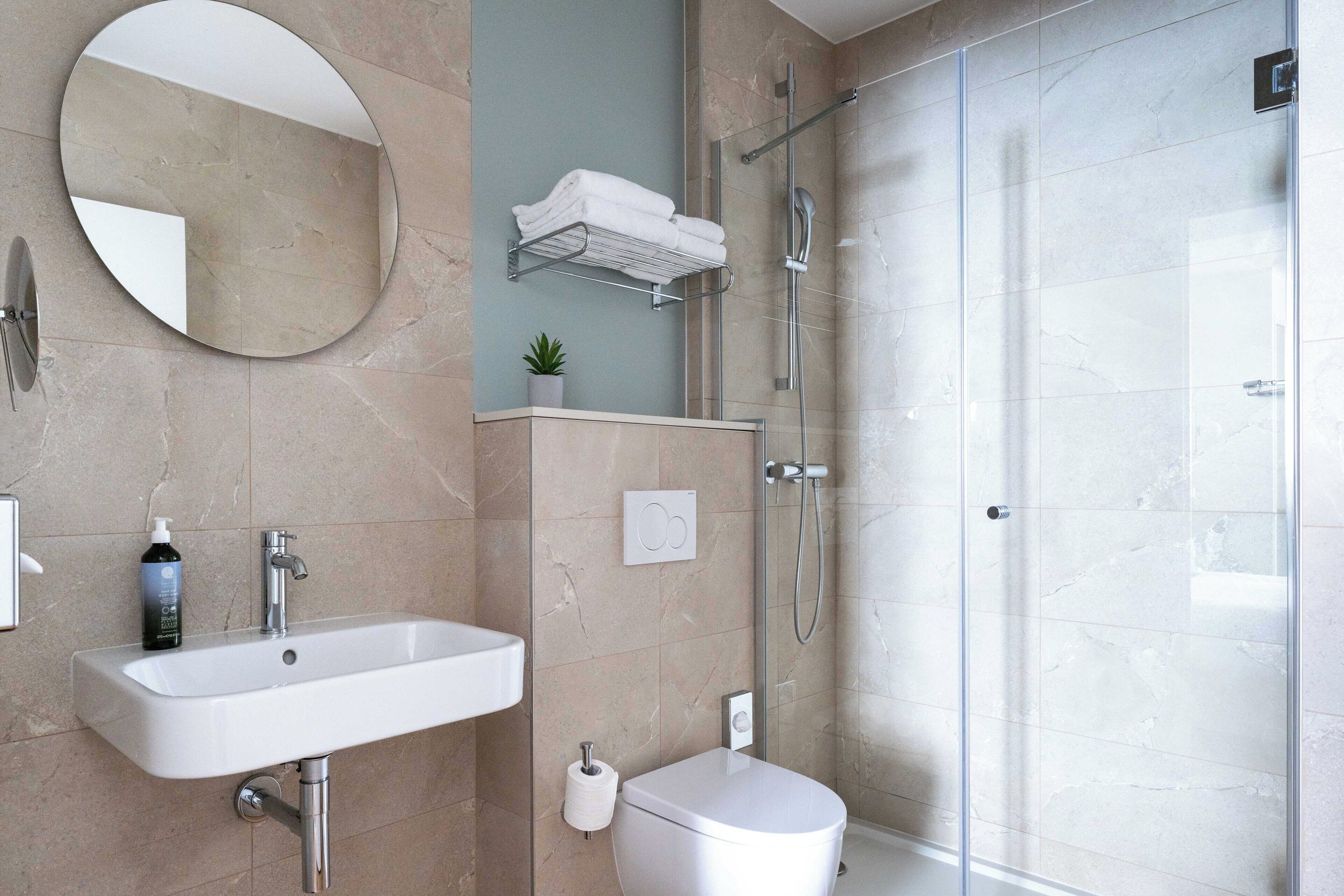 family, 2 rooms - complimentary soft minibar, courtesy tray, chromecast - snacks and digital press | bathroom | shower, eco-friendly toiletries, hair dryer, towels