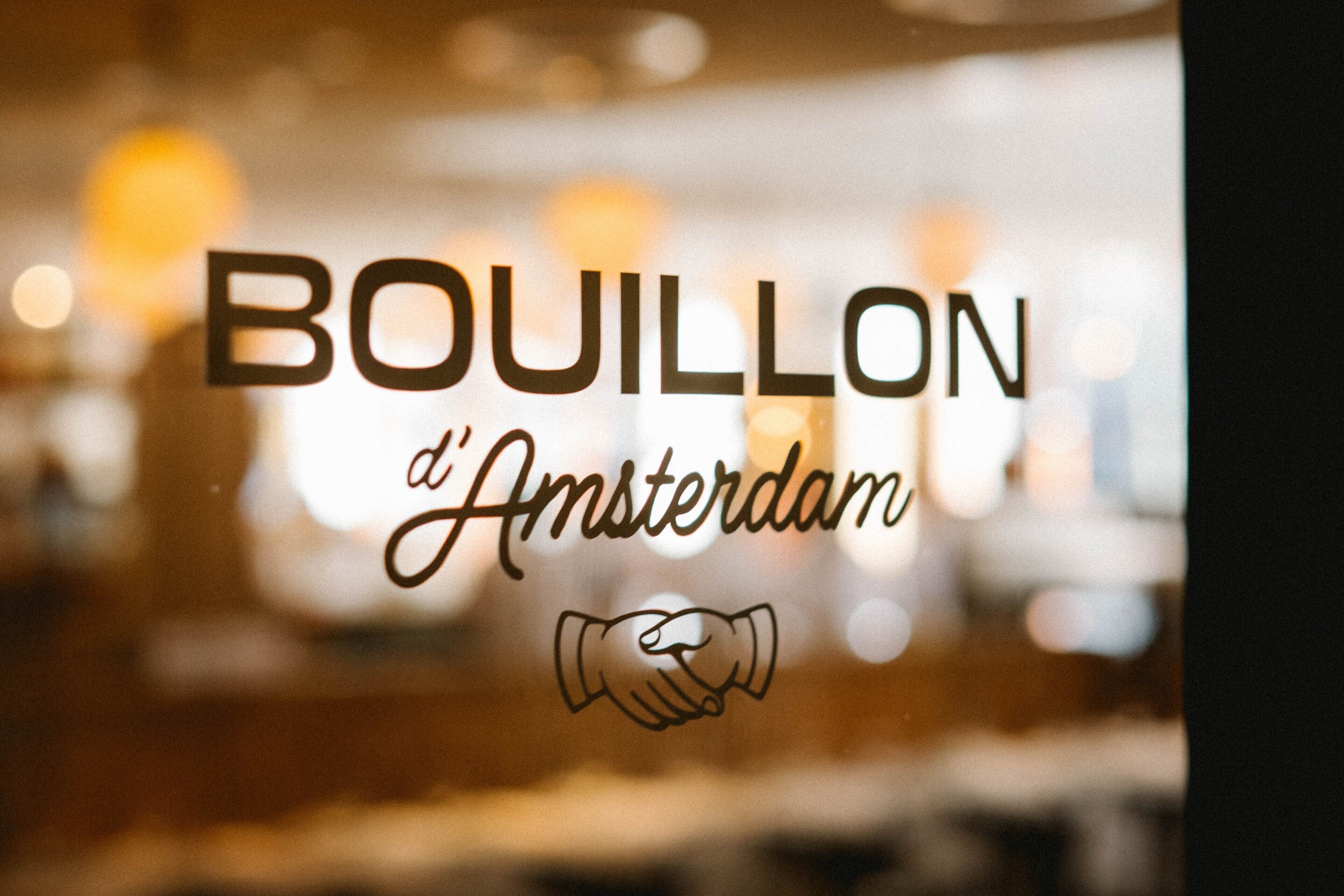 Uma janela com o texto 'BOUILLON d'Amsterdam' e um ícone de aperto de mão.