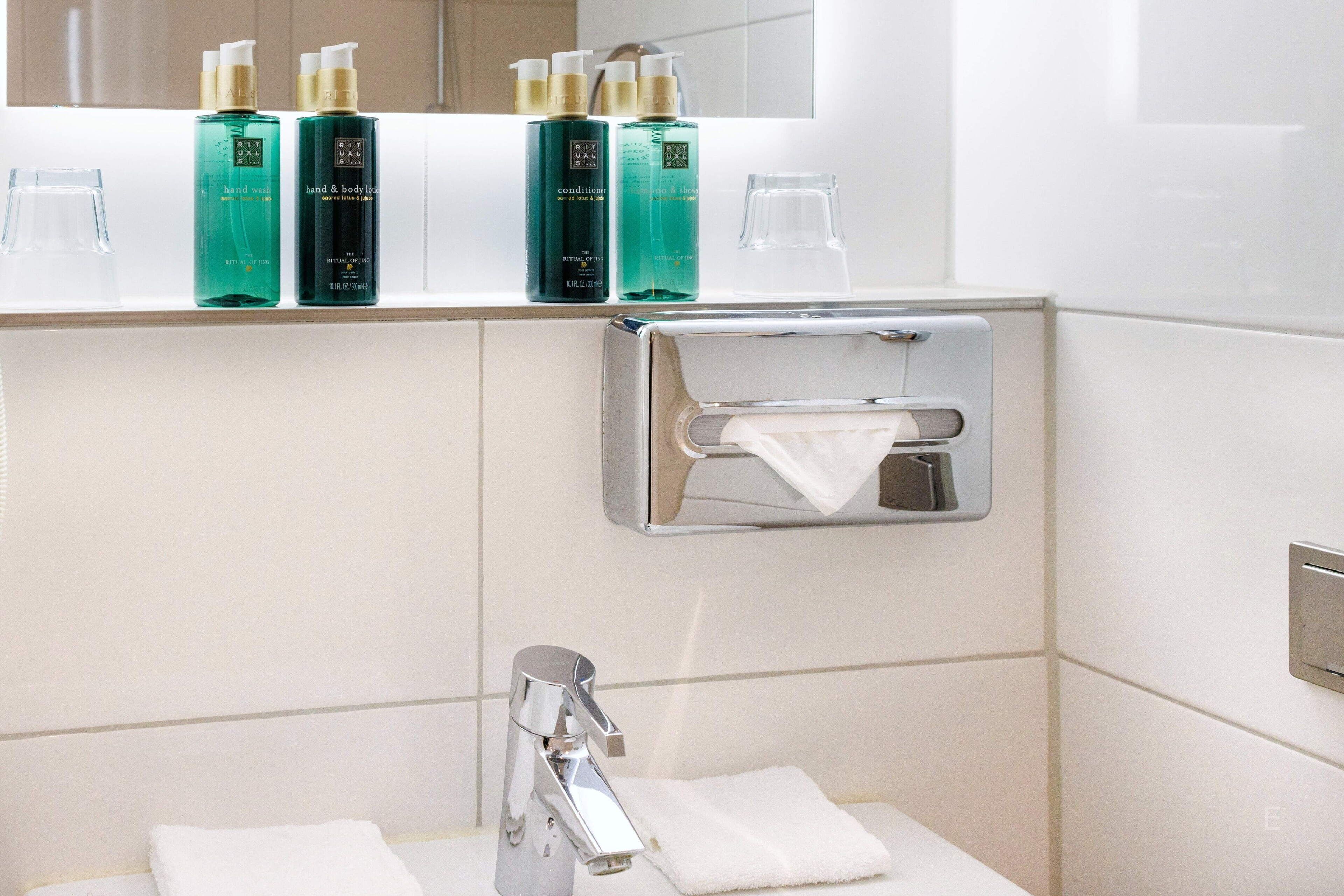 eco-friendly toiletries, hair dryer, towels, soap