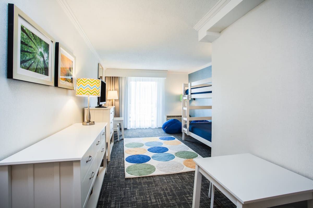 suite, multiple beds, balcony | 1 bedroom, in-room safe, desk, blackout curtains