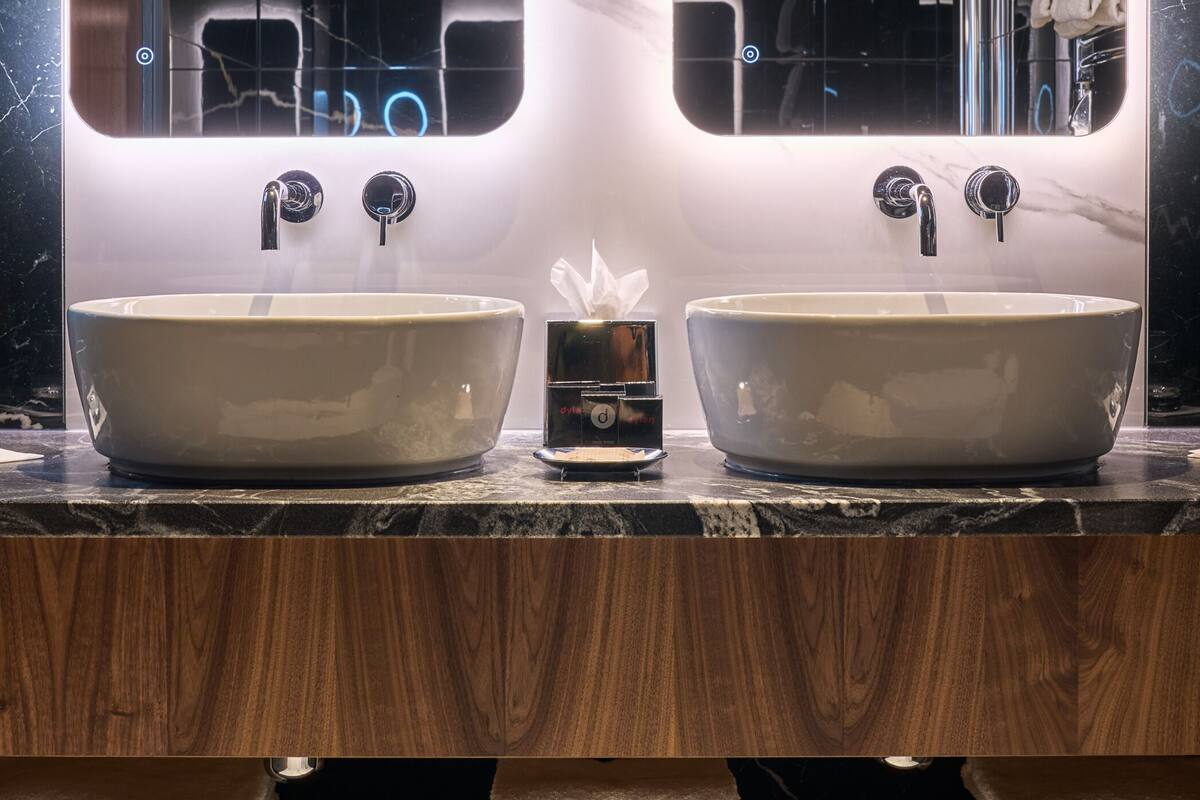 combined shower/bathtub, designer toiletries, hair dryer, bathrobes