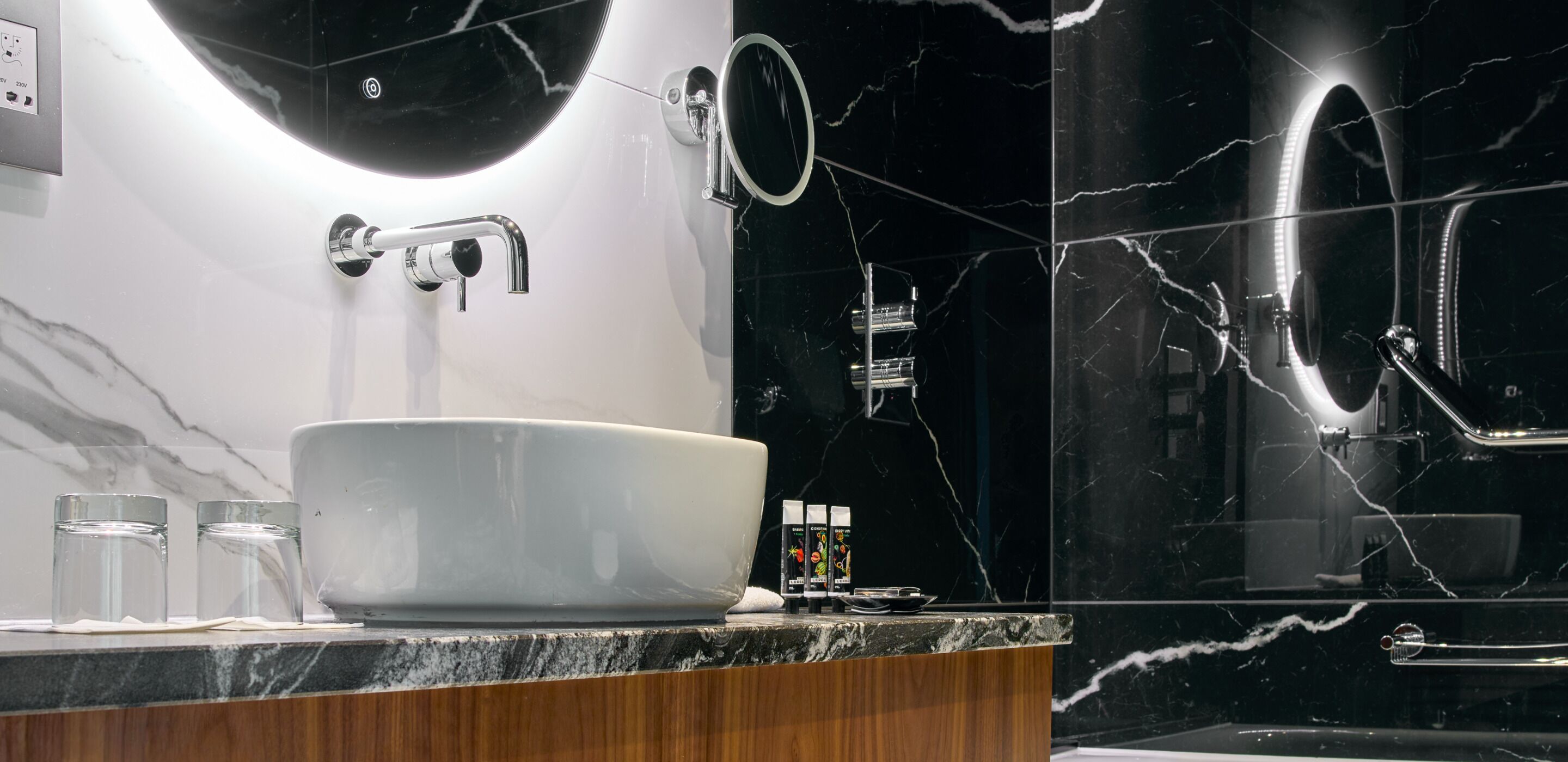 combined shower/bathtub, designer toiletries, hair dryer, bathrobes