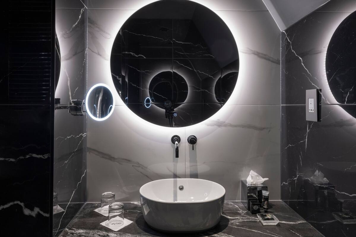 combined shower/bathtub, designer toiletries, hair dryer, bathrobes