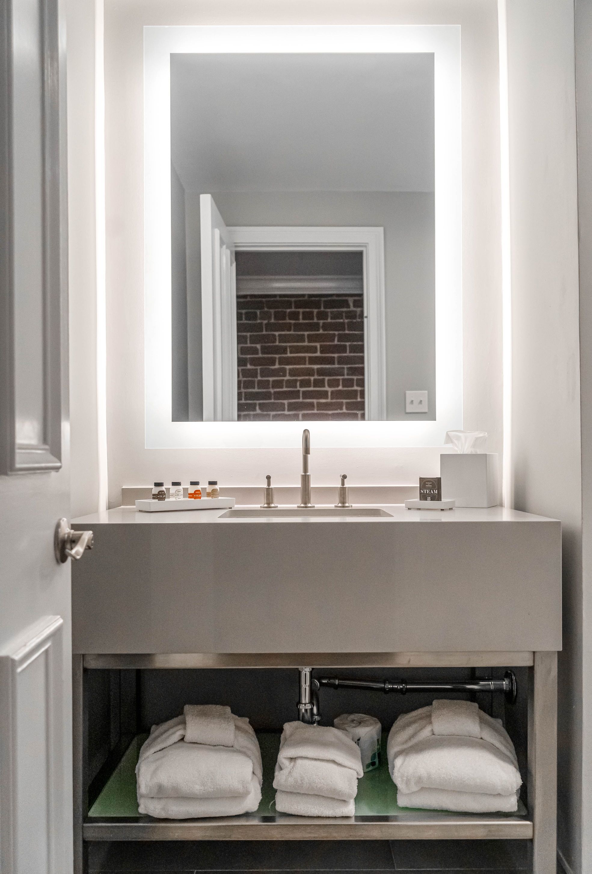 combined shower/bathtub, designer toiletries, hair dryer, towels