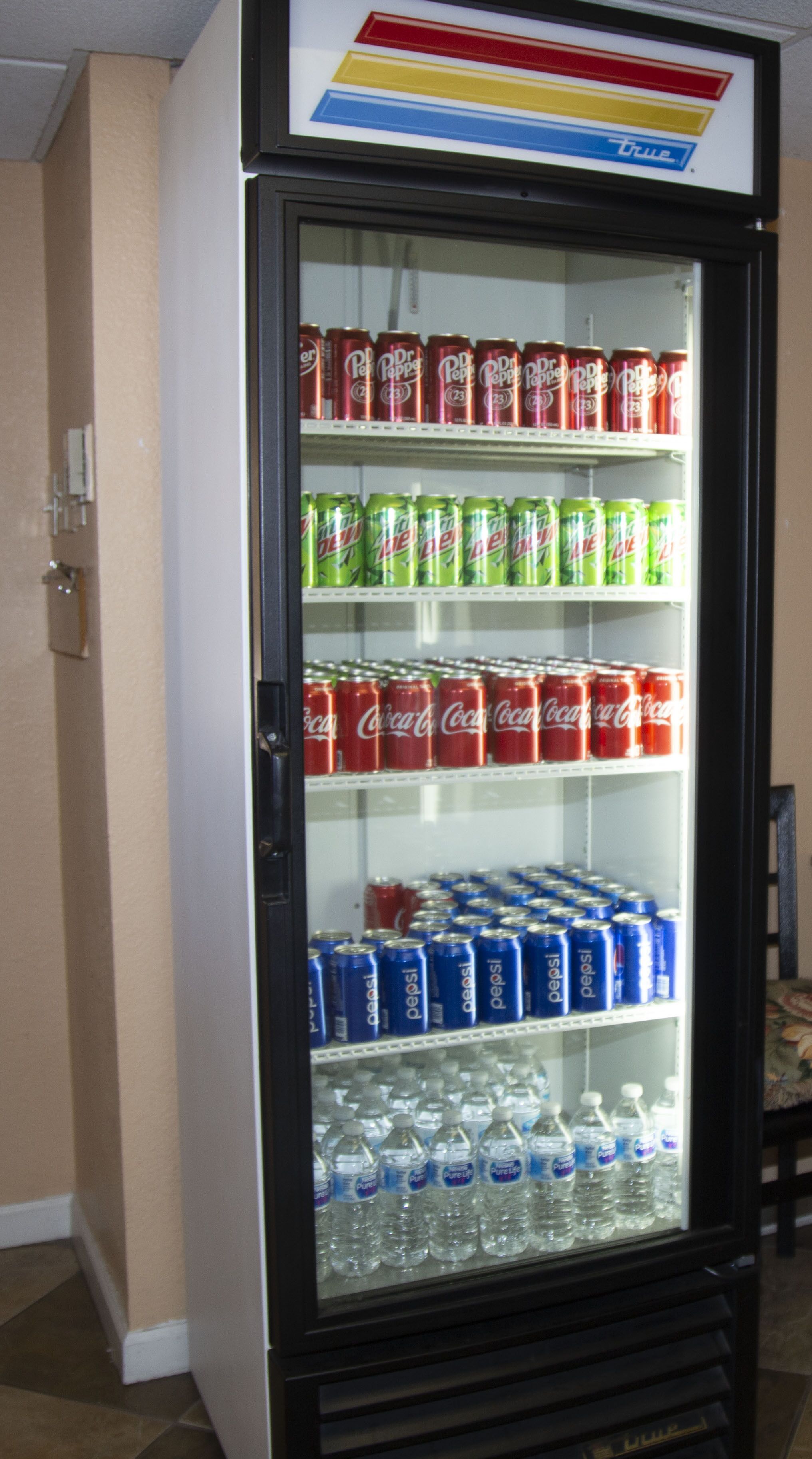 A vending machine with various beverages including Dr. Pepper, Mountain Dew, Coca-Cola, Pepsi, and water.