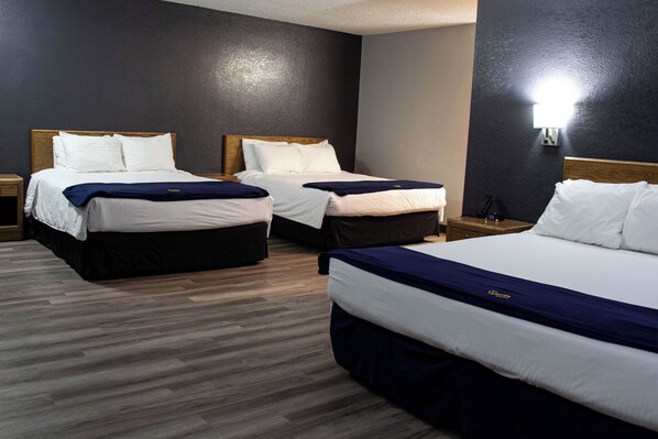 Suite, Multiple Beds | Desk, laptop workspace, blackout drapes, iron/ironing board