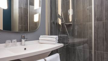 Shower, eco-friendly toiletries, hair dryer, towels