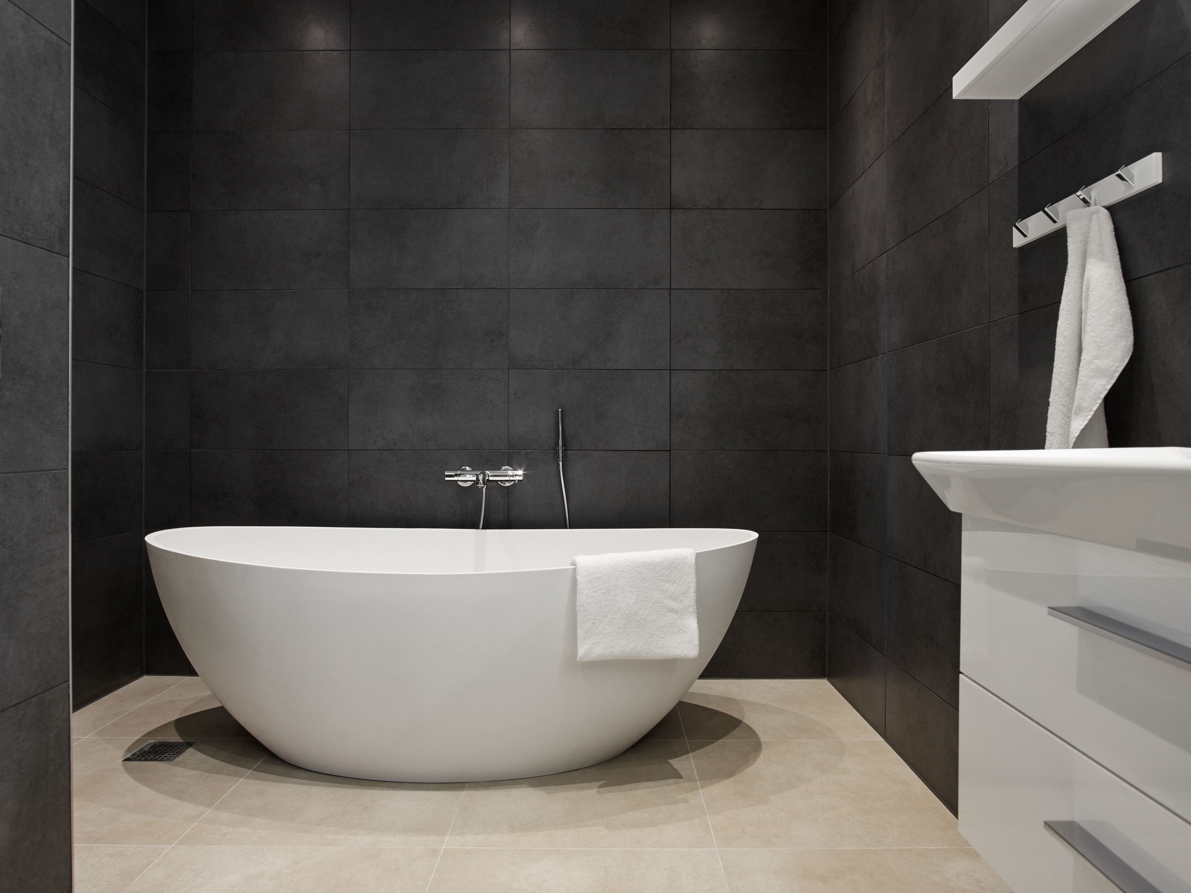 design suite, balcony, fjord view, main building | bathroom | eco-friendly toiletries, hair dryer, towels