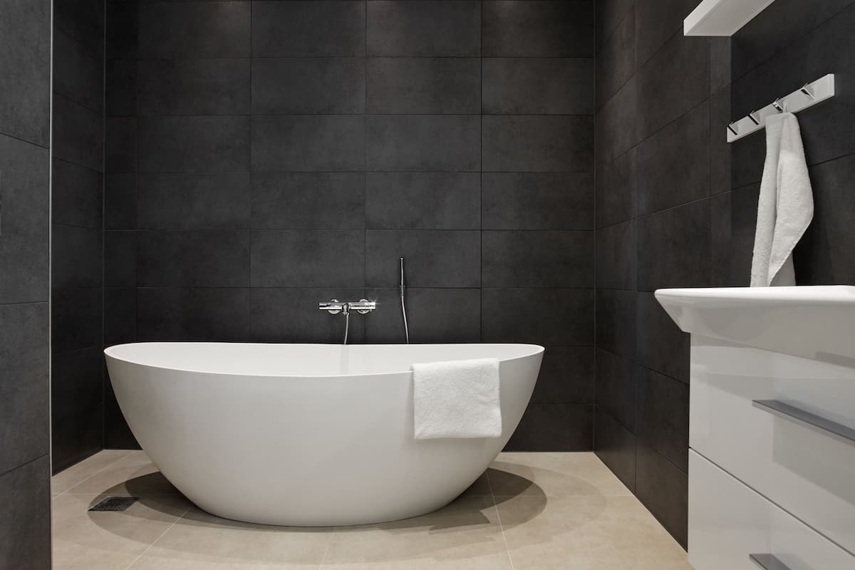 design suite, balcony, fjord view, main building | bathroom | eco-friendly toiletries, hair dryer, towels