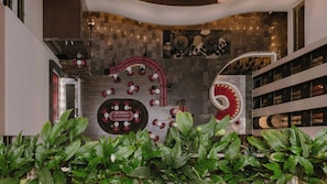 A modern interior with a central seating area, a spiral staircase, and a decorative wall. - InterContinental Brisbane by IHG (Brisbane)