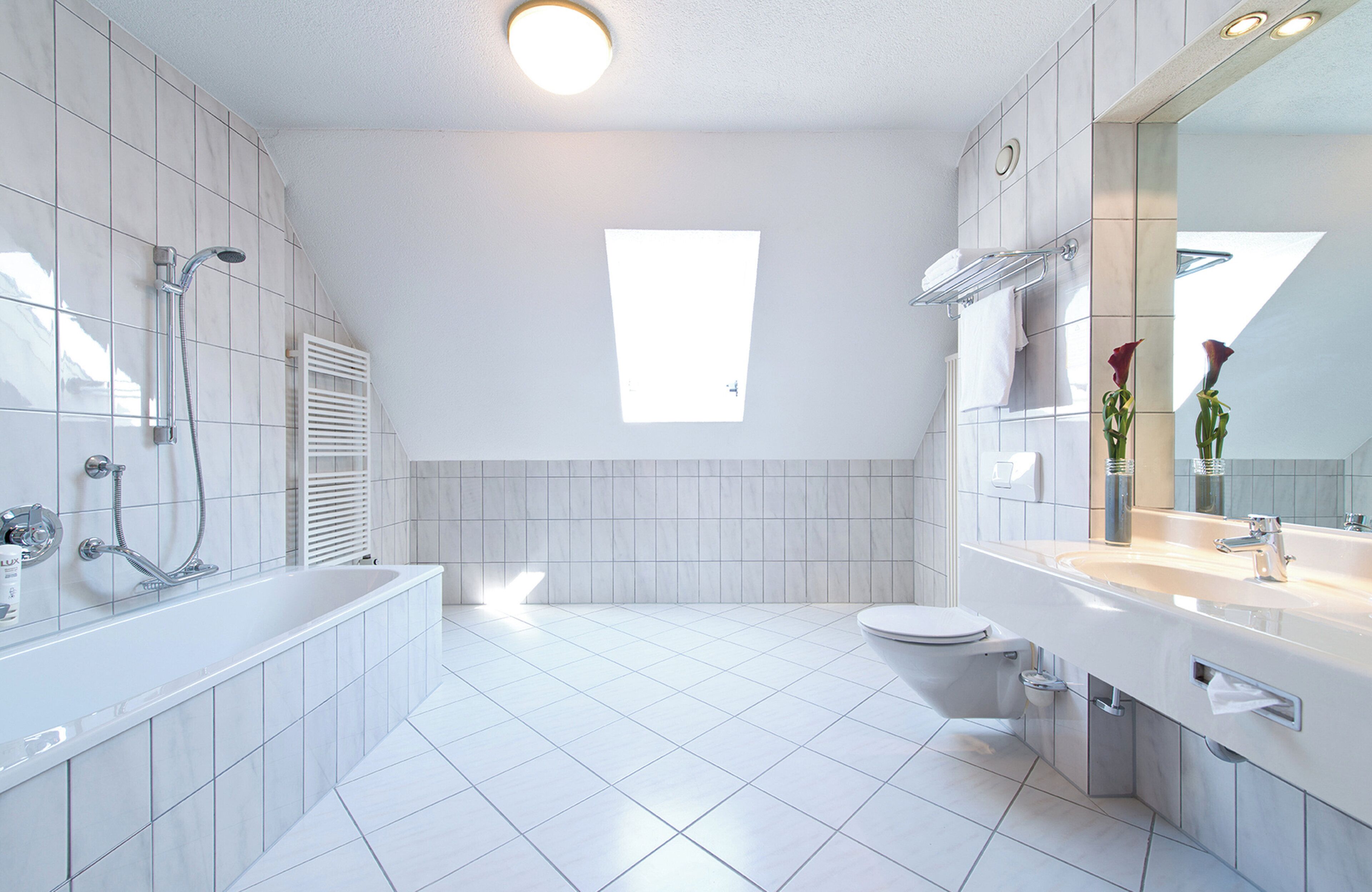 family room | bathroom | combined shower/bathtub, hair dryer, towels