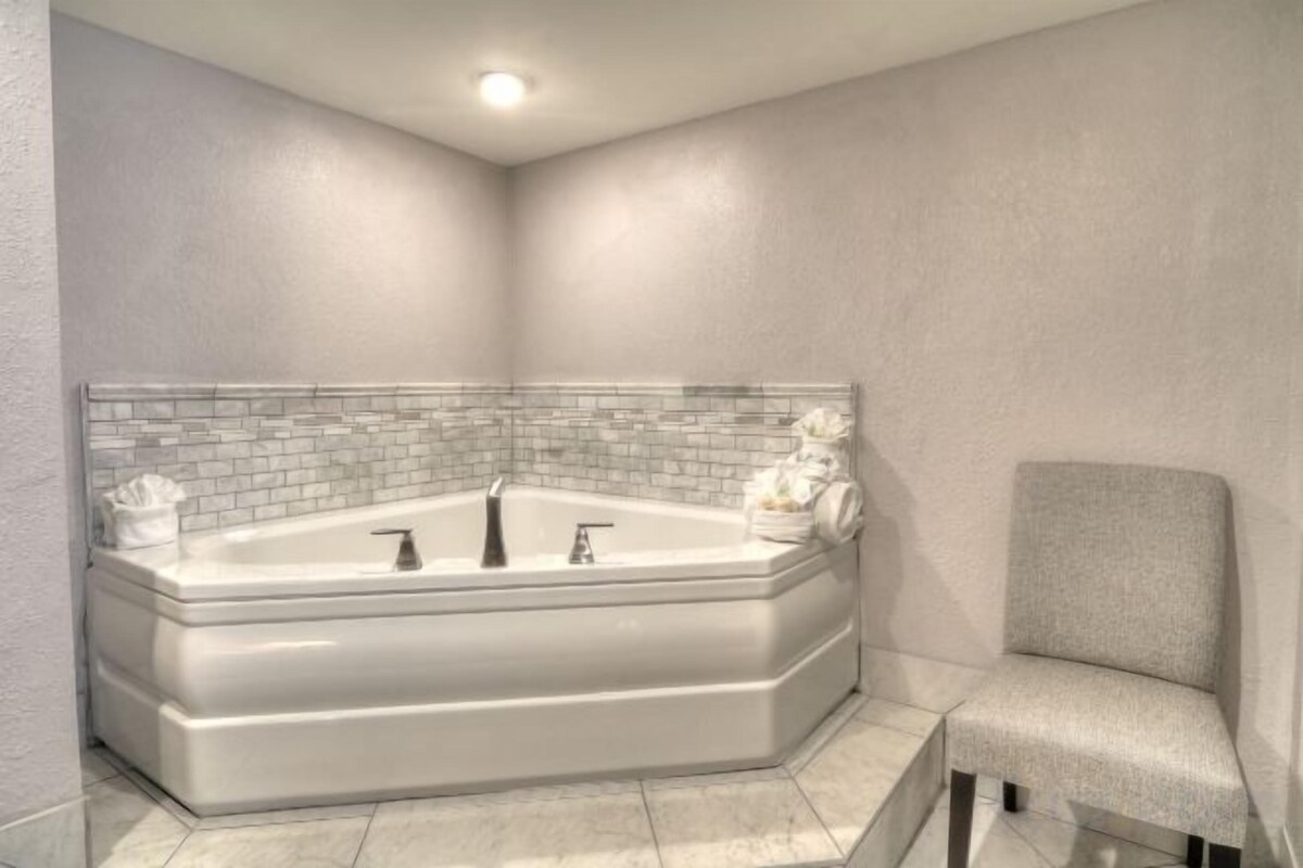 Bathroom | Designer toiletries, hair dryer, towels, soap