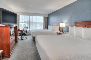Enjoy a city view from the comfort of this stylish room, featuring two single beds and a flat-screen TV.
