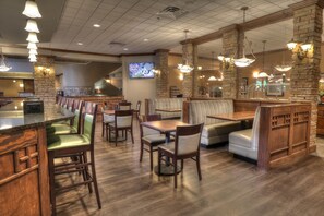 Enjoy dining in our spacious restaurant with a long counter, booths, and tables, perfect for groups and families.