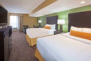 Premium bedding, desk, laptop workspace, blackout drapes