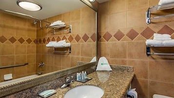 Combined shower/tub, rainfall showerhead, free toiletries, hair dryer