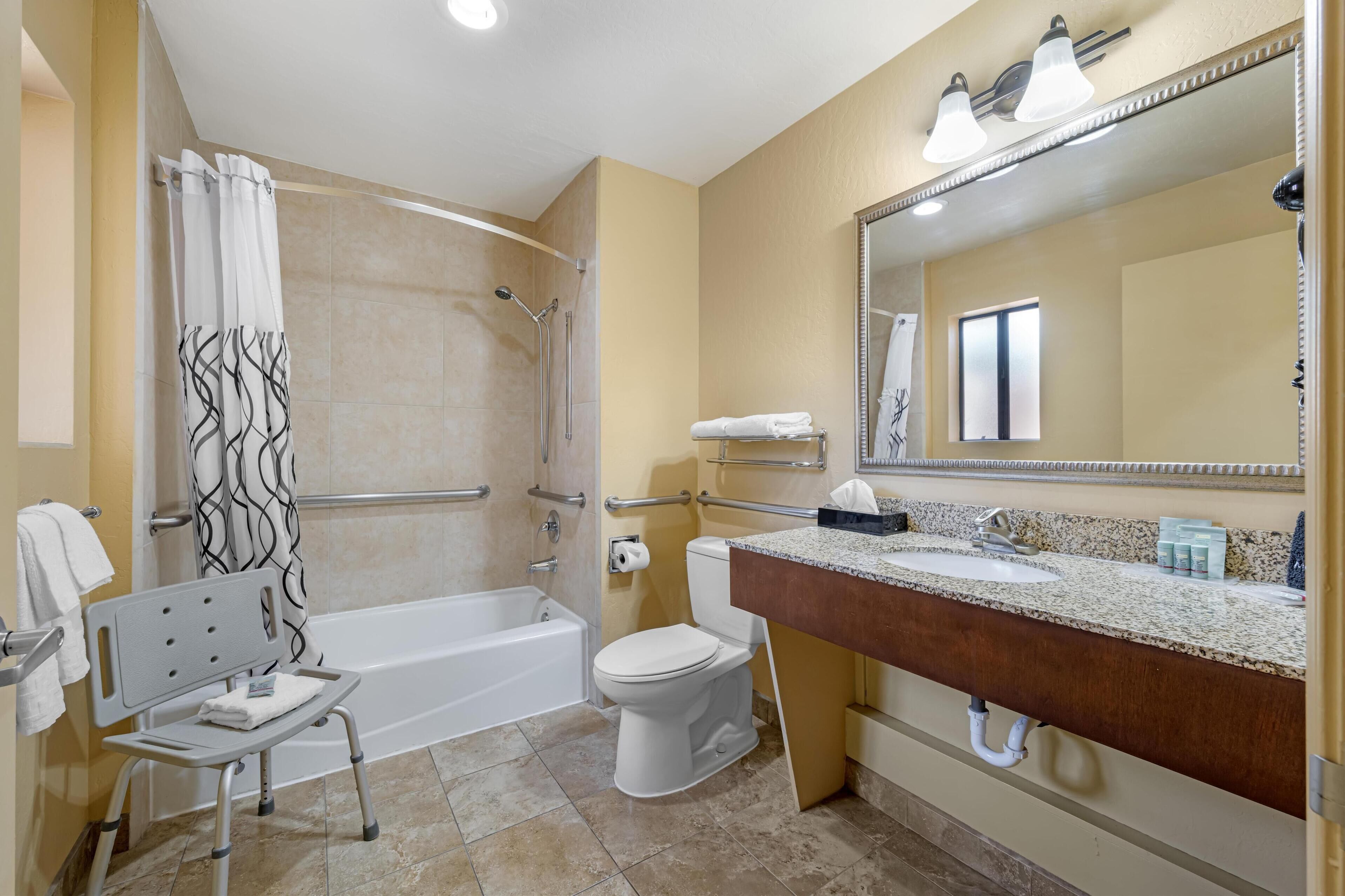 room, 1 king bed, refrigerator & microwave | bathroom | combined shower/bathtub, free toiletries, hair dryer, towels