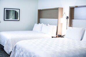 Hypo-allergenic bedding, desk, laptop workspace, blackout drapes