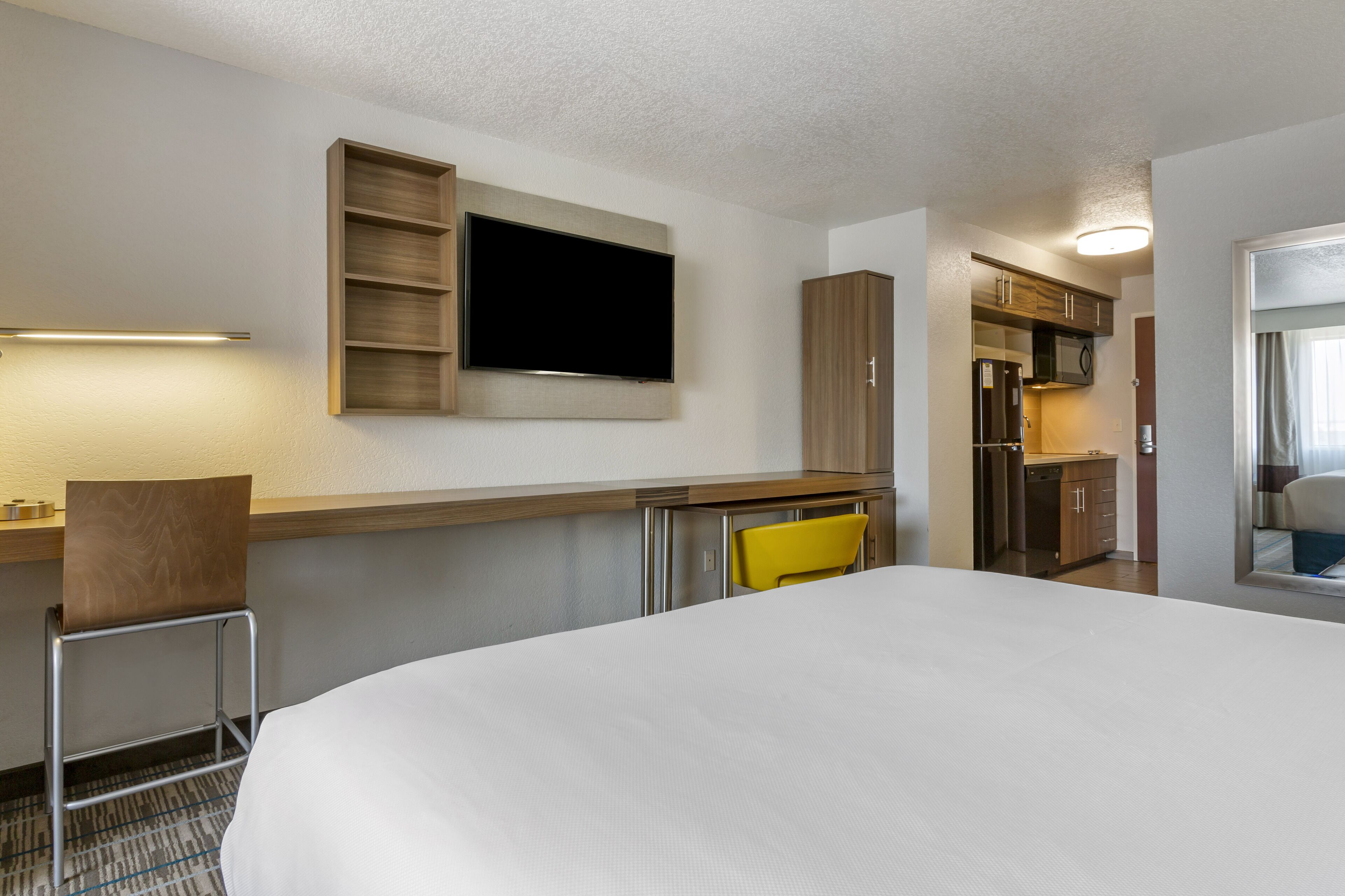 premium bedding, pillow-top beds, desk, laptop workspace