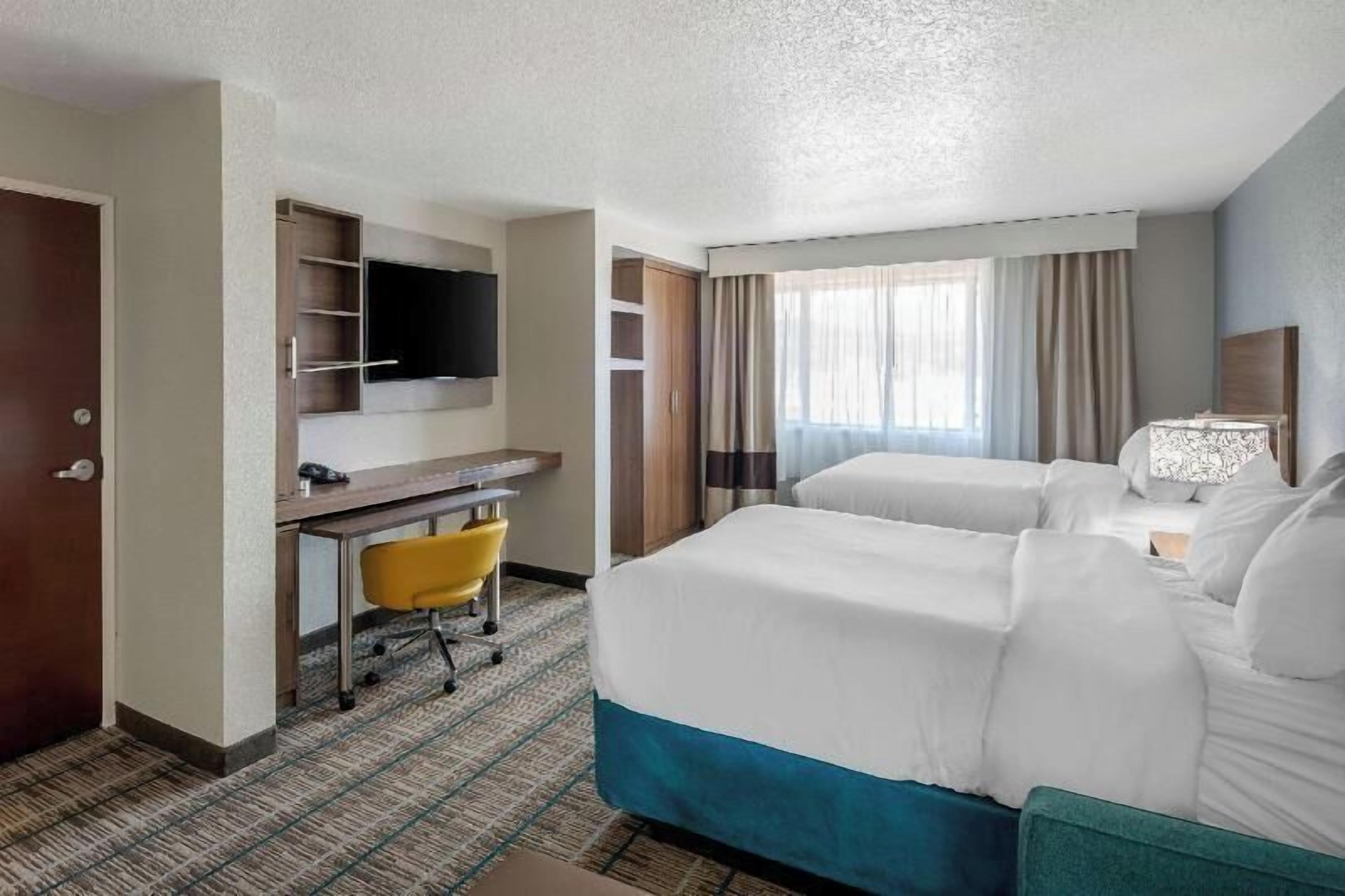 Premium bedding, pillowtop beds, desk, laptop workspace