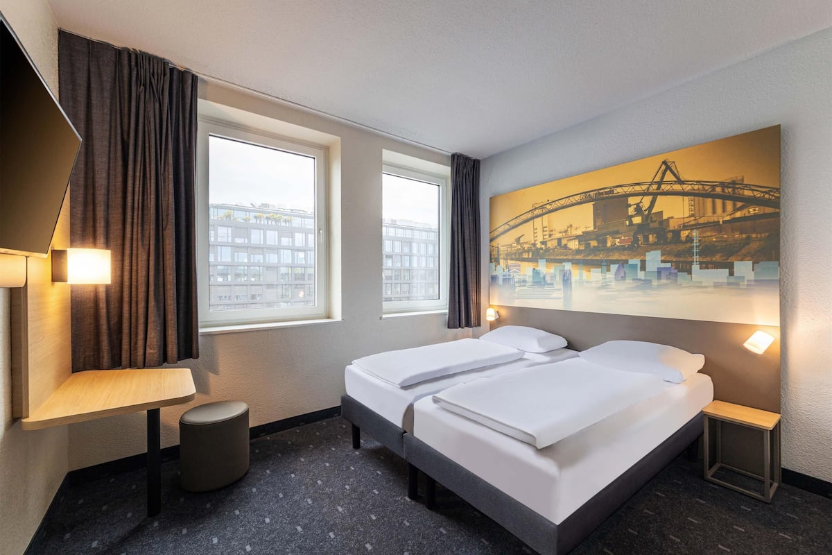 Chambre avec lits jumeaux | 1 chambre, coffre-fort, bureau, système d’insonorisation