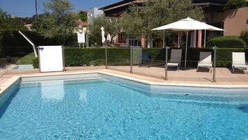 Seasonal outdoor pool, pool umbrellas, sun loungers