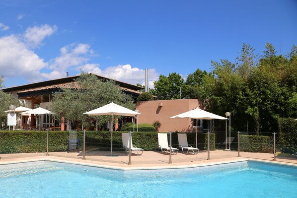 Seasonal outdoor pool, pool umbrellas, pool loungers