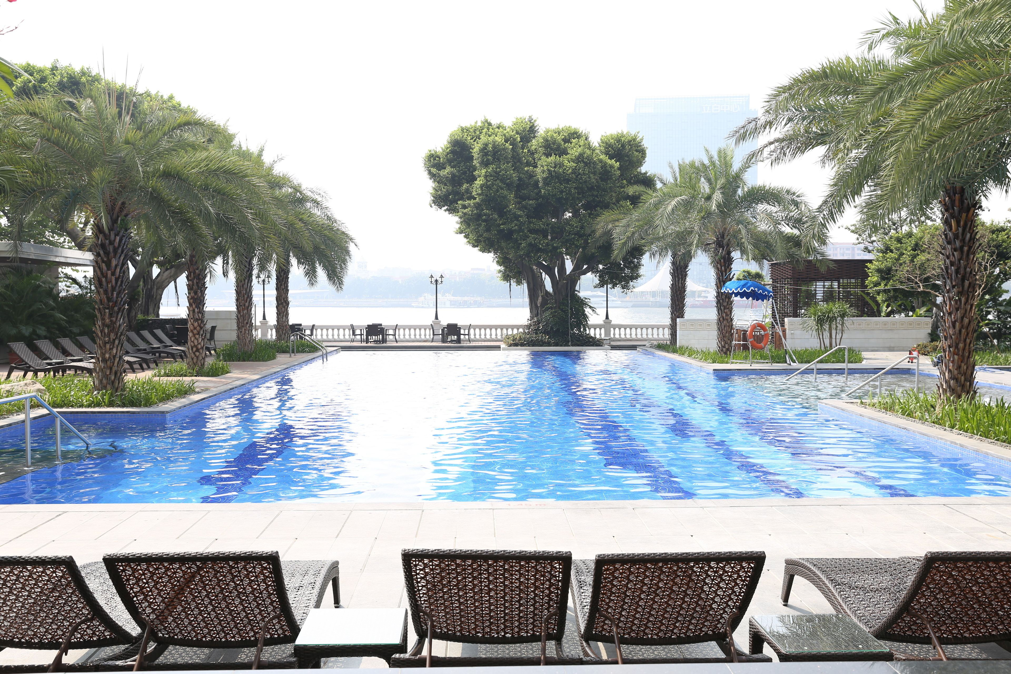 outdoor pool, pool umbrellas, pool loungers