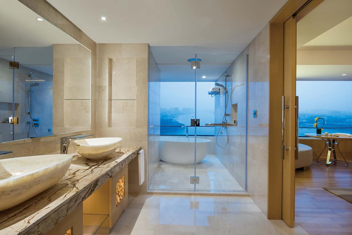 designer toiletries, hair dryer, bathrobes, slippers