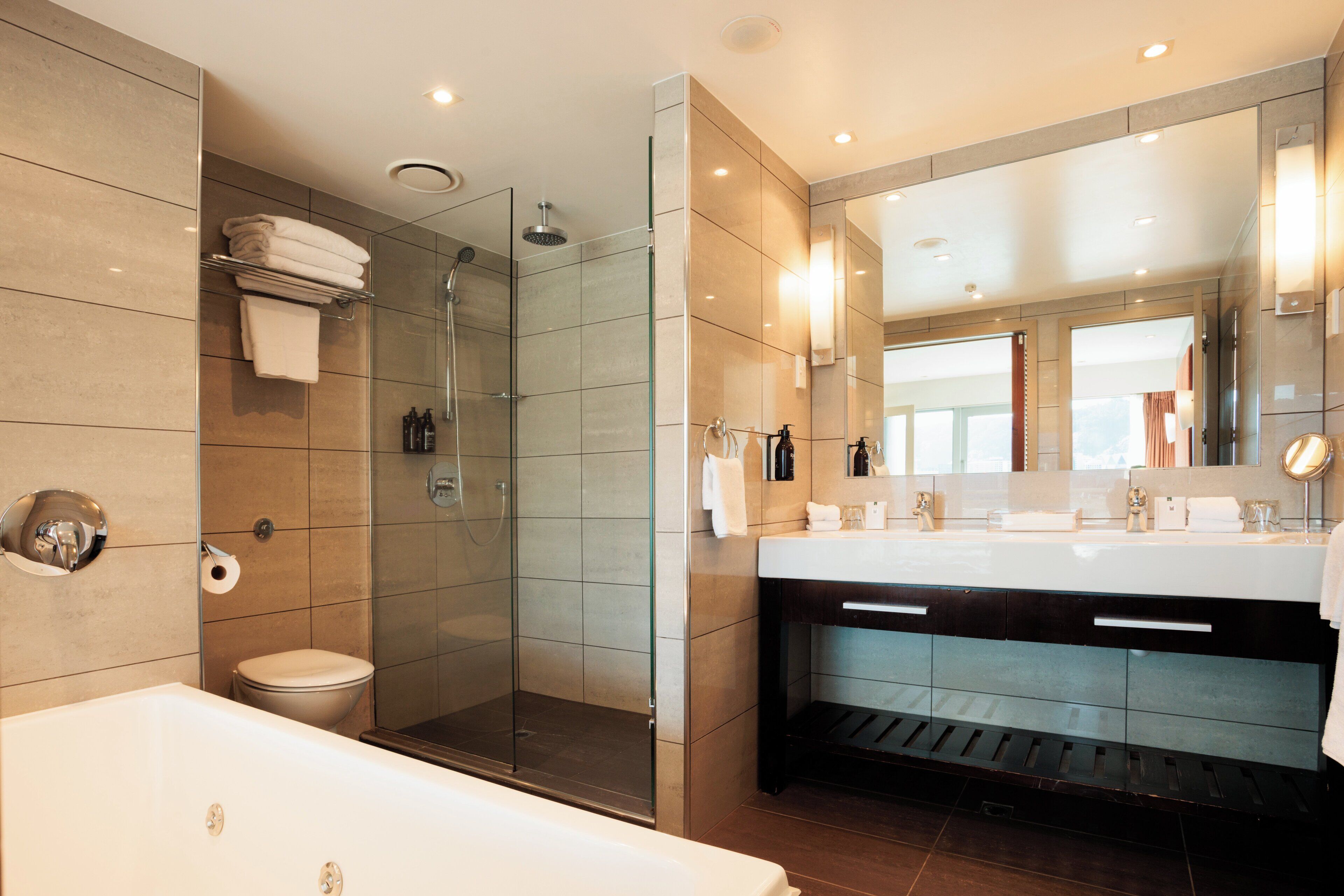 junior suite | bathroom | eco-friendly toiletries, hair dryer, slippers, towels