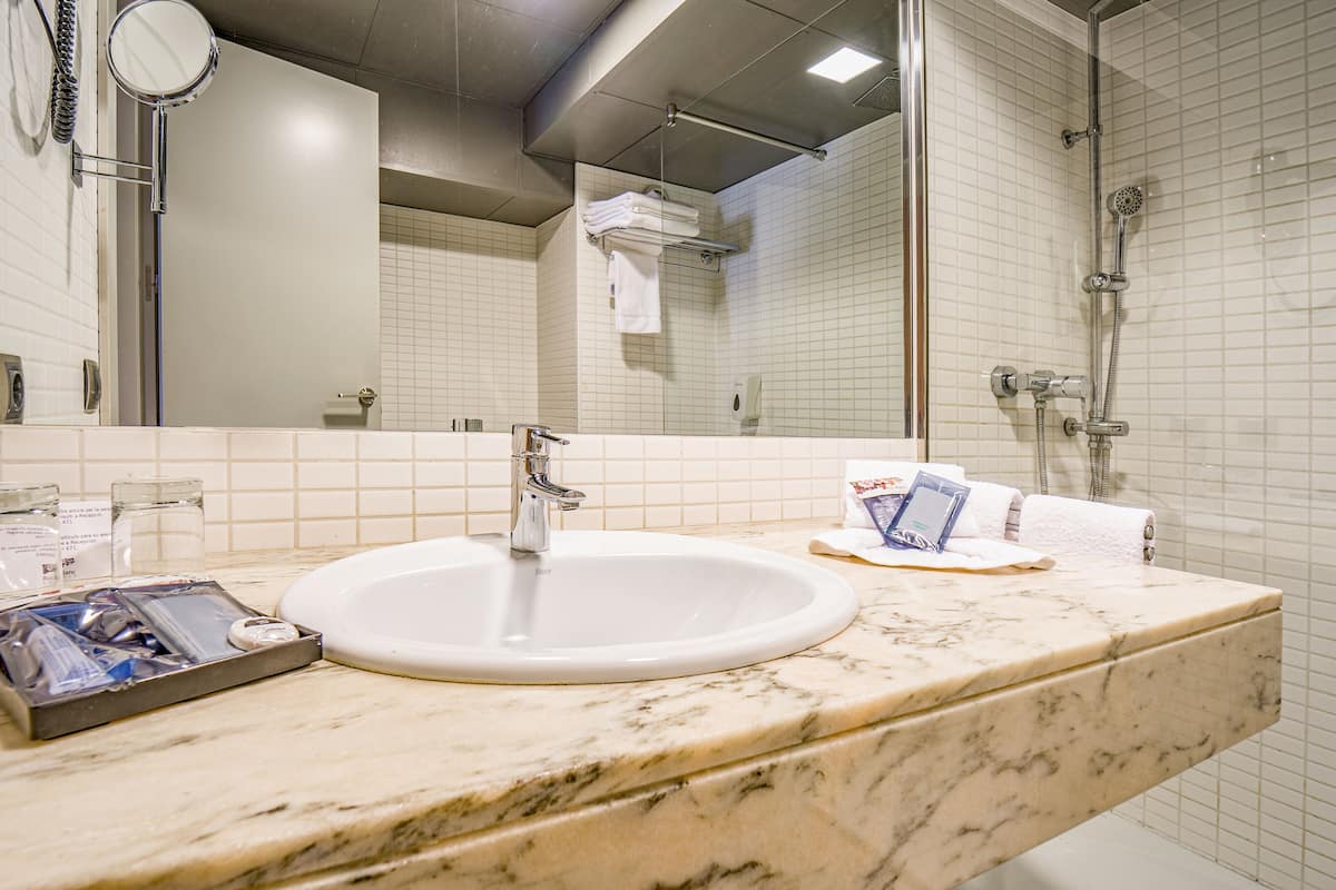 eco-friendly toiletries, hair dryer, bathrobes, slippers