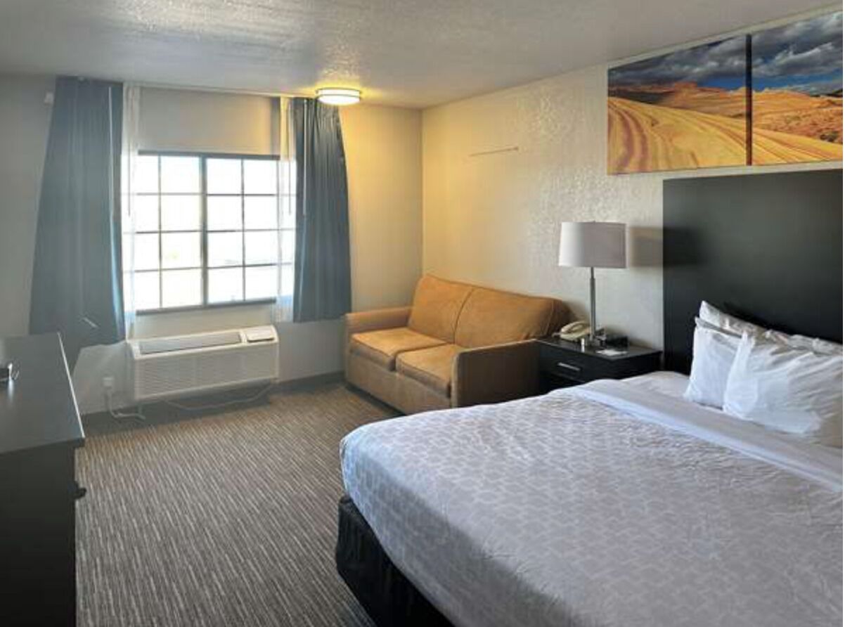Suite, 1 King Bed with Sofa bed, Non Smoking | Hypo-allergenic bedding available, desk, iron/ironing board